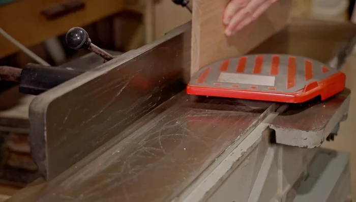 Cut grooves in both sides of each joint to create a spline joint. This strengthens the cabinet.