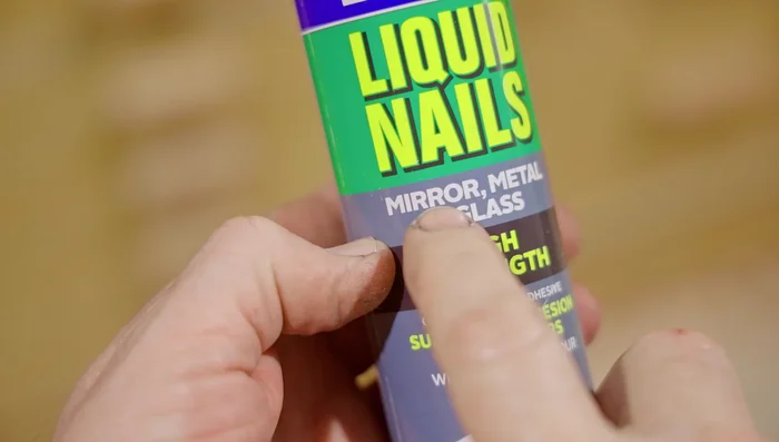 Install the cabinet into the bathroom using stainless steel screws and a diamond drill bit for the tiles.