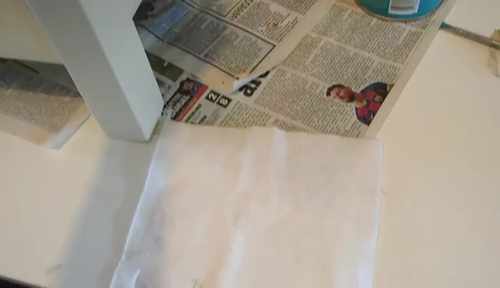 Assemble the bed with the mattress and custom-made cushions.