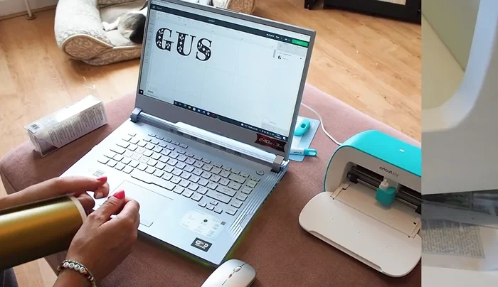 Add a name to the bed using a Cricut machine (optional).