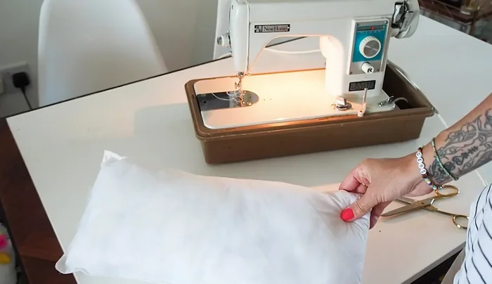 Cut and sew cushions from existing fabric and stuffing.