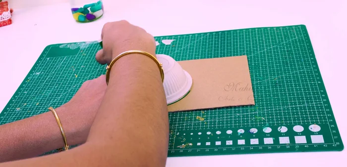 Make a hole in the top of the cup and insert a craft cylinder/PV pipe.