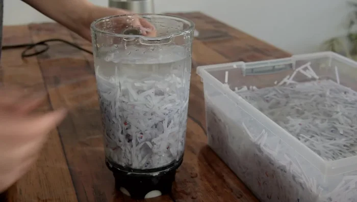 Create paper pulp: Add soaked paper to blender with water and blend on high speed until smooth. If using an alternative to a blender, mash or shake until a pulp consistency is achieved.