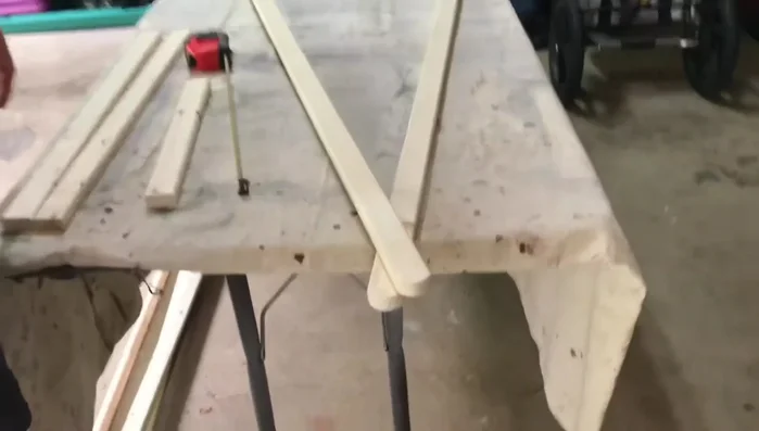 Assemble the frame: Attach the 14-inch shelf supports to the legs using screws, ensuring even spacing.