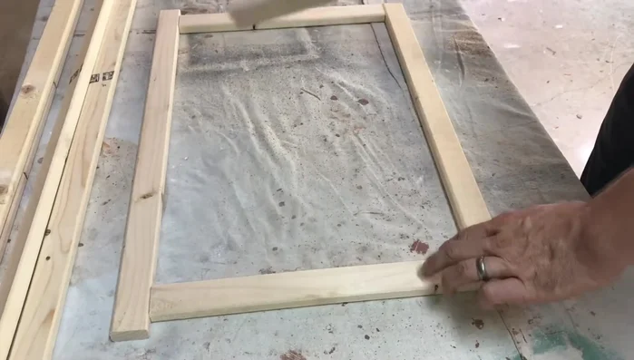 Assemble the frame: Attach the 14-inch shelf supports to the legs using screws, ensuring even spacing.