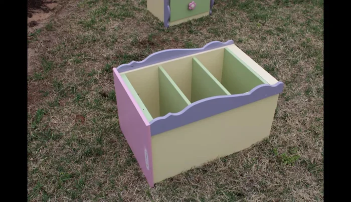 Fill holes in the cabinet top with stainable wood filler and sand smooth.