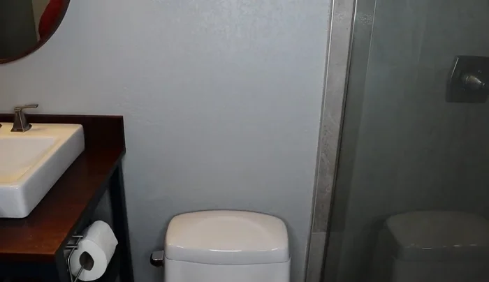 Use a stud finder to locate wall studs if possible. This will provide extra support. If you can't find studs, mark the location for pilot holes if desired.