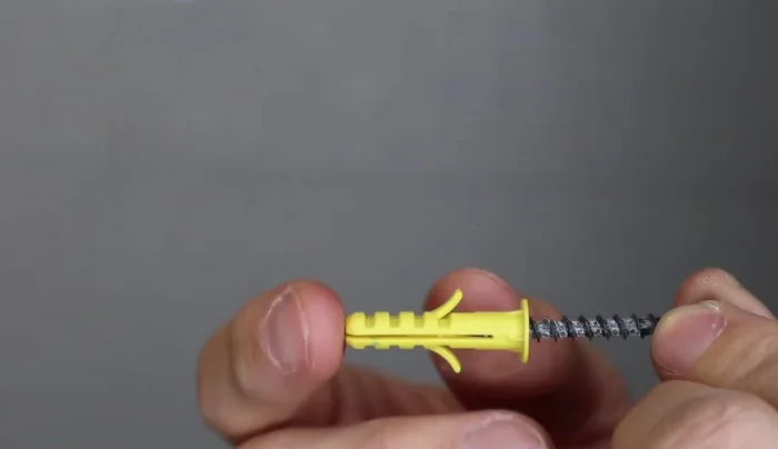 Insert and secure the drywall anchors into the pilot holes (if necessary).