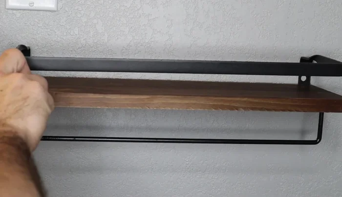 Hang the shelves, aligning them with the brackets. Tighten the screws securely to ensure the shelves are stable.