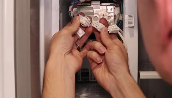 Reinstall the top panel, securing it with screws.