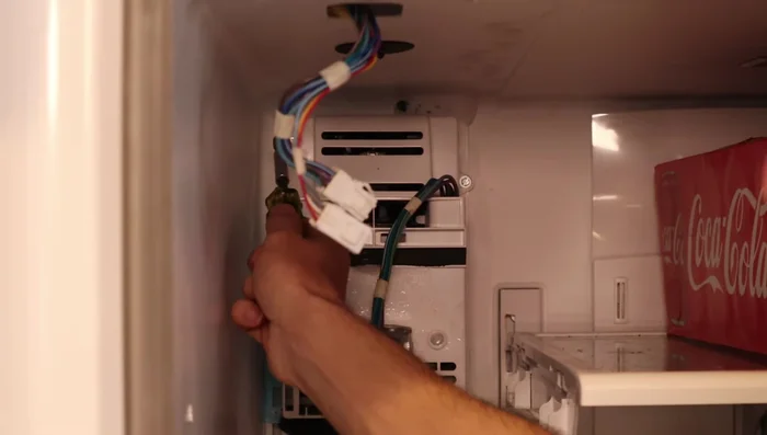 Remove the ice maker unit, noting ice buildup.