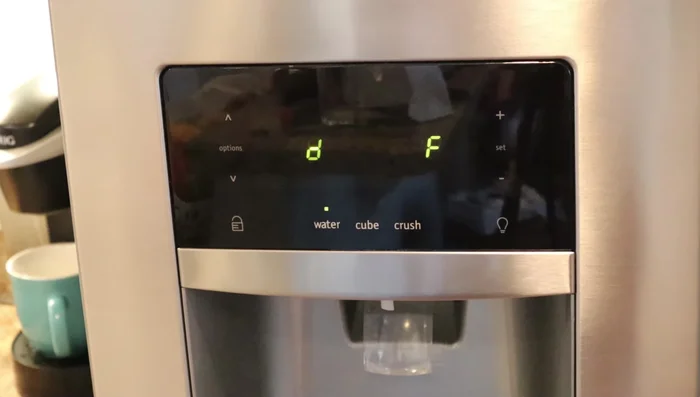 Remove ice buildup from the drain hole.