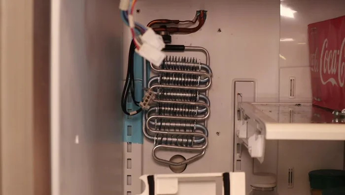 Remove ice buildup from the drain hole.