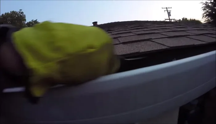 Loosen the bottom edge of the shingles using a putty knife.