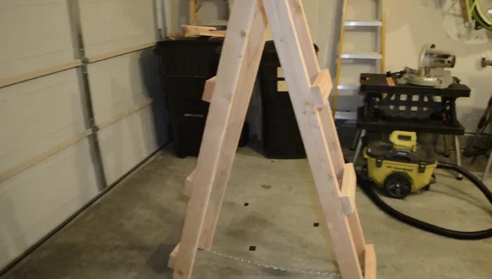 Attach the double loop chains to maintain the desired ladder angle and prevent overextension.