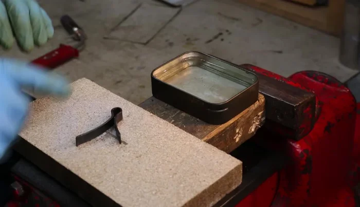 Quench the hot spring in oil to harden it.