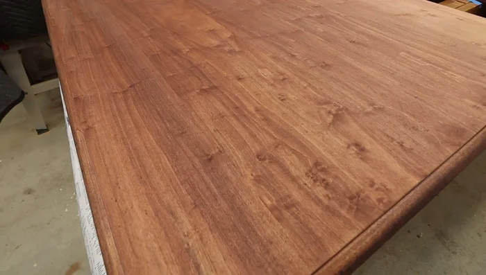 Apply a sealer coat and allow it to dry. Sand lightly.