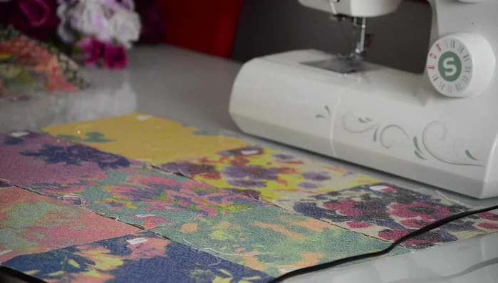 Arrange fabric patches in desired order.