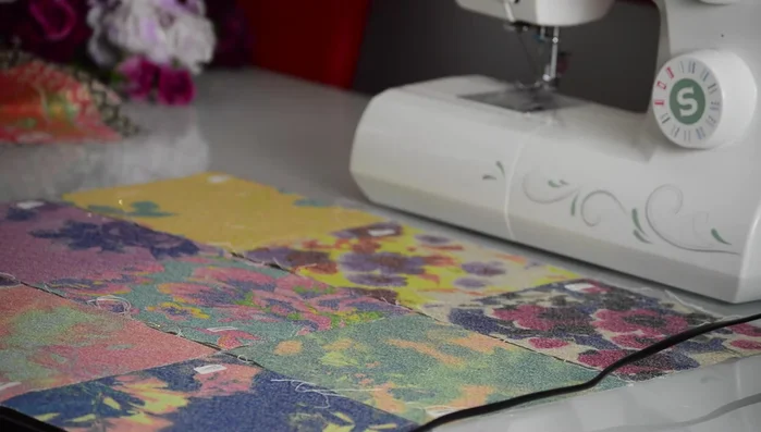 Arrange fabric patches in desired order.