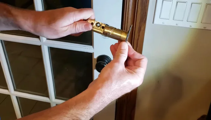 Adjust the length of the deadbolt as needed to fit your door.