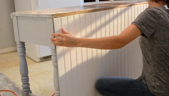 Secure the B board to the desk using a finishing nail gun.