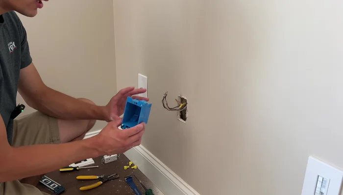 Fish the wire from the outlet box to the fixture box.