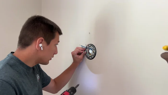 Mount the fixture and install the light bulb.