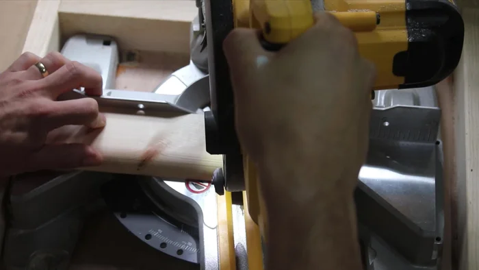 Mark a 90-degree angle on the top of the legs using a speed square and cut them off. This side will lean against the wall.