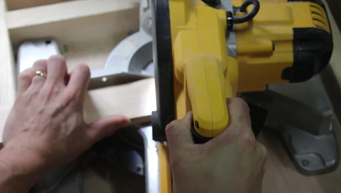 Mark a 90-degree angle on the top of the legs using a speed square and cut them off. This side will lean against the wall.