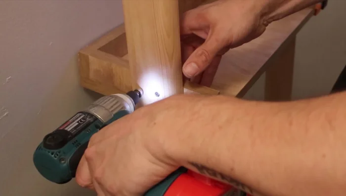 Drill pilot holes to prevent wood splitting. Use another wall for support, ensuring both walls are plumb.