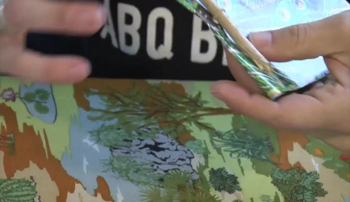 Thread the other end of the rubber band through the second loop to secure the notebook.