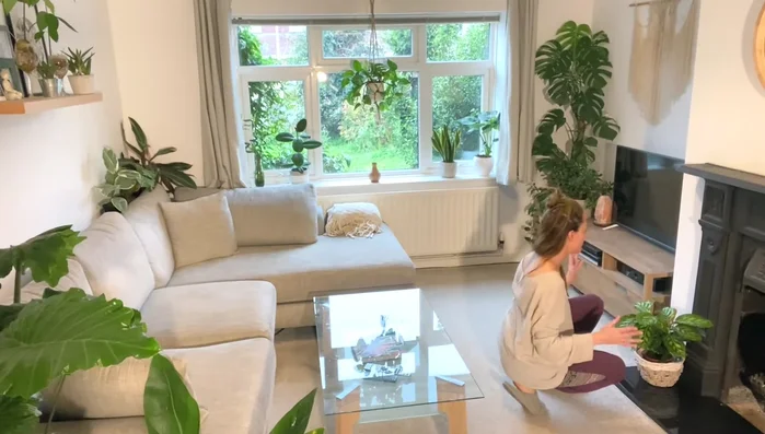 Add plants to darker areas to create contrast and visual appeal. Consider using a fireplace (when not in use) for a unique plant display.