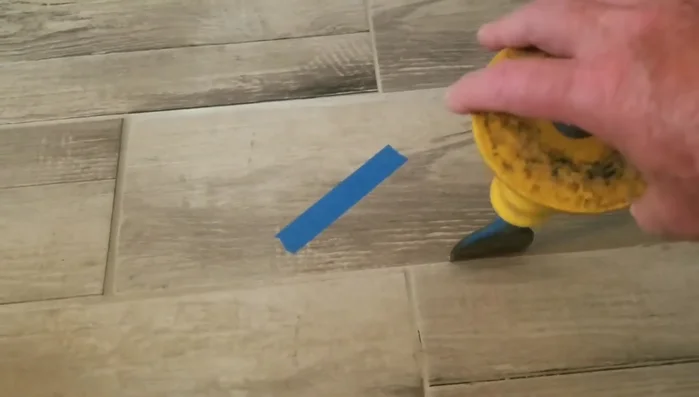 Clean out the old mortar and grout completely, ensuring a flat and smooth surface for the new tile. Pay close attention to the edges and corners.