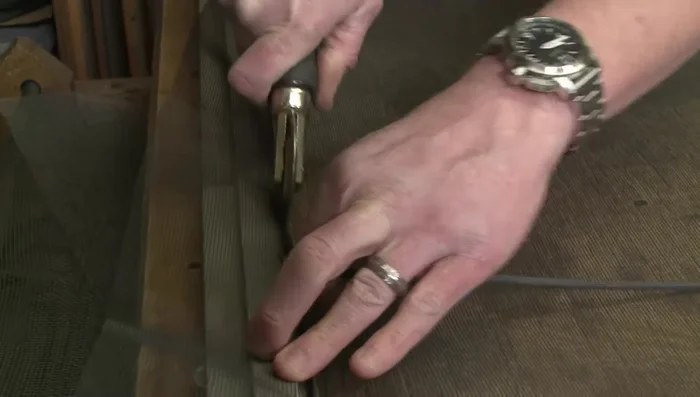 Start from the bottom and add the spline, stretching it slightly as you go. Work in two L shapes (one for the side and top, one for the side and bottom).