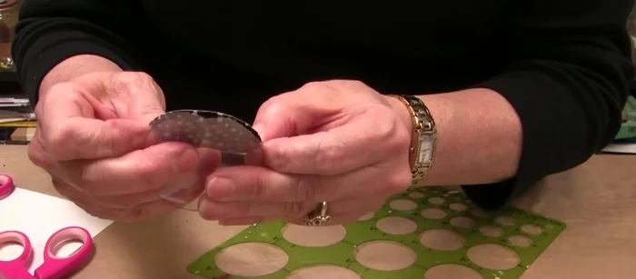 Attach the eyelets to the buckle using the eyelet setter.