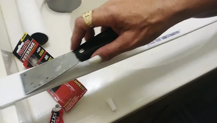 Use duct tape to hold the trim in place while the glue dries.