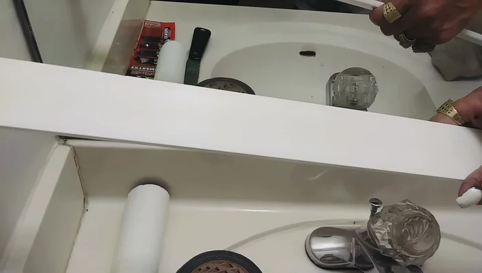 Cut a piece of plastic trim to size using the oscillating tool with a super fine blade. Sand the edges for a smooth finish.