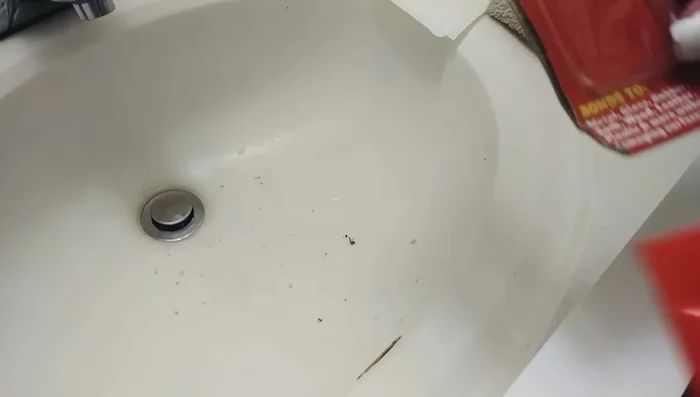 Use duct tape to hold the trim in place while the glue dries.