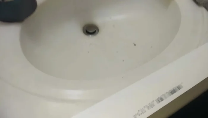 Clean the area around the damaged frame with alcohol.