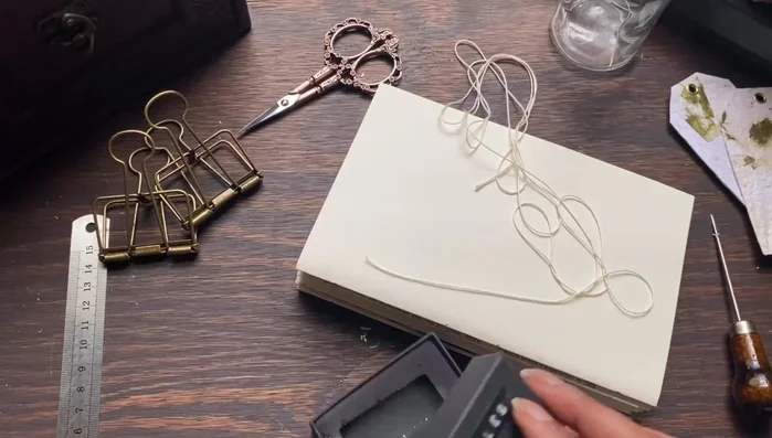 Sew the signatures together using a kettle stitch (video tutorial linked in description).