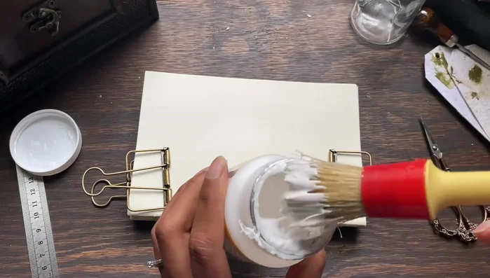 Place the book under a stack of books or a book press to flatten.