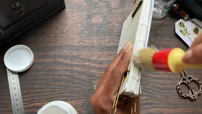 Place the book under a stack of books or a book press to flatten.