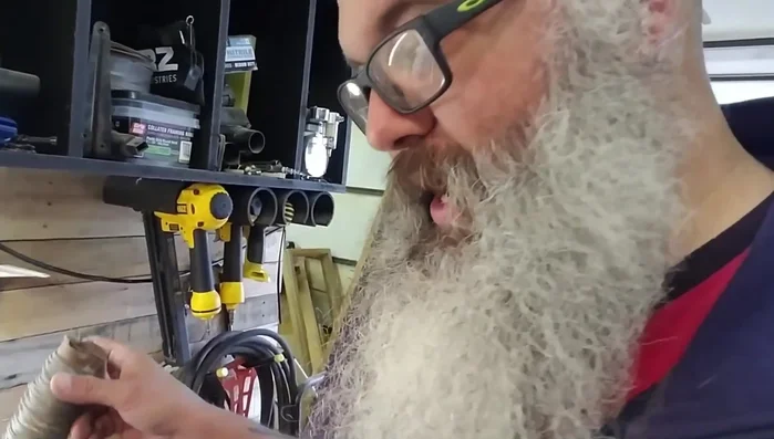 Secure the chain by slightly pulling it to create a V-shape in the steel wire.