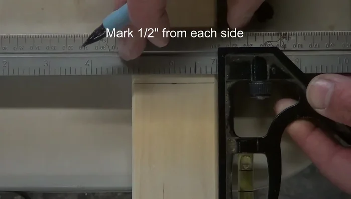 Create center punch marks: Make two marks, half an inch apart, on each of the eight lines.