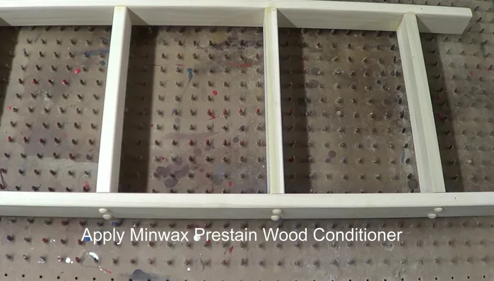 Attach hanging hardware: Attach screw eyes at the top of the rack.