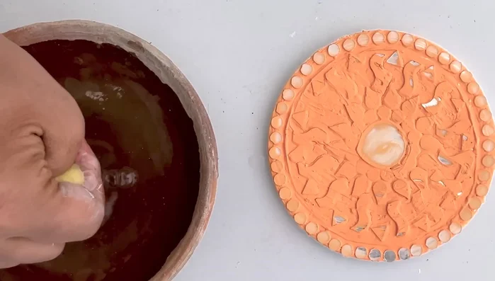 Clean excess putty: After 15-20 minutes, gently wipe away excess putty from the mirrors with a damp sponge or cloth.