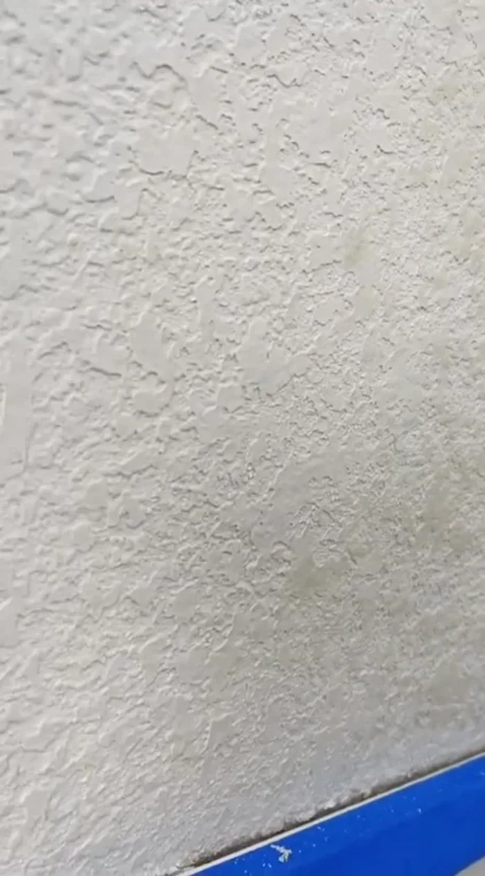 For a seamless finish, lightly scrape off any high points after painting to blend the patch with existing texture.