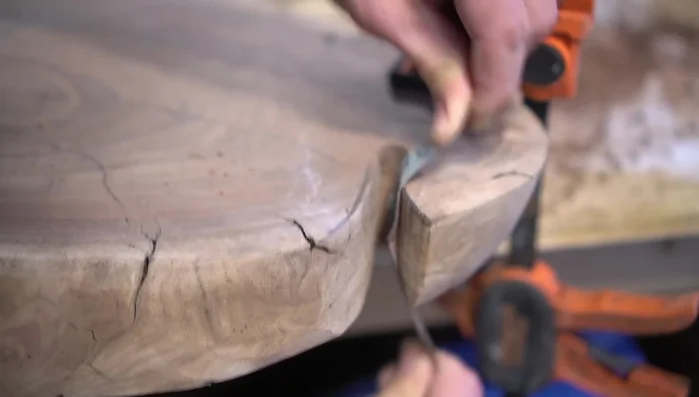 Use a router with a round-over bit to smooth edges.