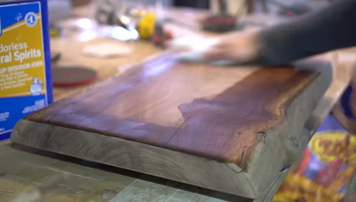 De-dust the slab using mineral spirits and a tack cloth.