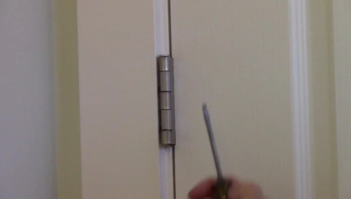 Remove a hinge pin: Use a screwdriver (or nail) to tap out the pin from the bottom of the hinge.